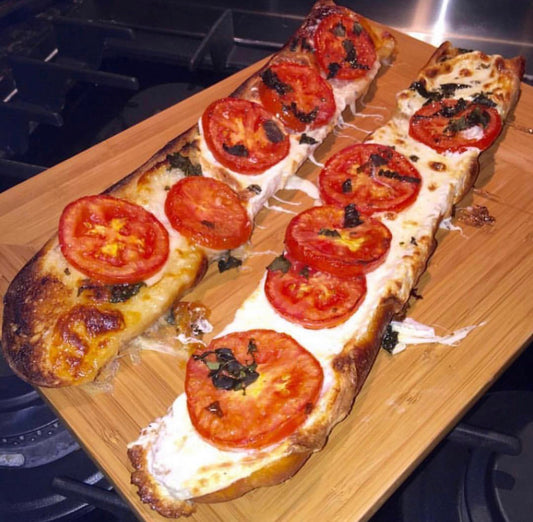 French Bread Pizza with fresh mozzarella tomatoes & JJS OWN Basil Vinaigrette